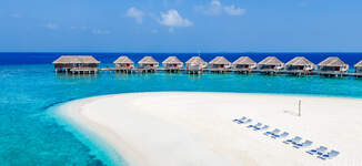 dusit-thani-maldives-exterior-beach-aerial-daytime-Grande.jpg